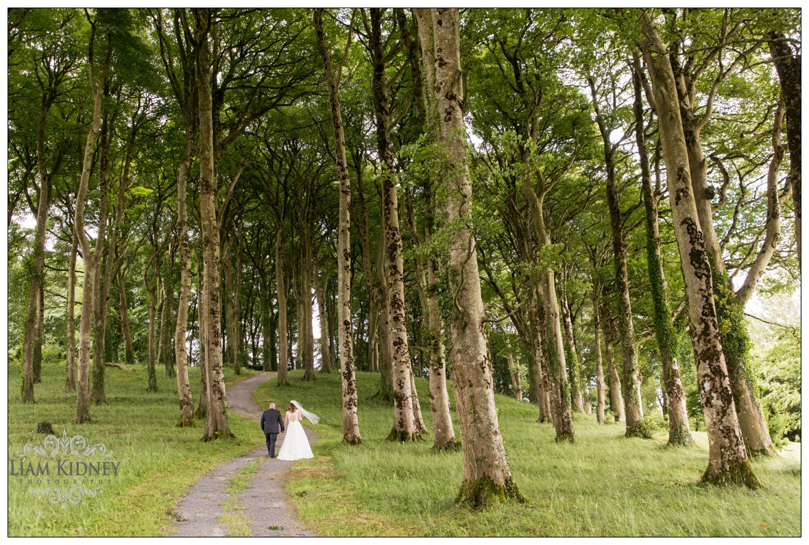 Kasia And Stan walking in the forrest at Glasson Country House Hotel Wedding, Athlone, Co. Westmeath